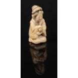 A Japanese Meiji period carved ivory small okimono. Formed as a kneeling Bijin. Signed to the