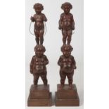 A pair of 19th century Flemish carved wooden small sculptures. Each depict a pair of children in