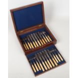A Victorian walnut cased canteen of silver plated fish knives and forks by Hawksworth, Eyre & Co for