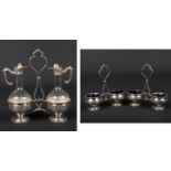 A French silver and glass oil and vinegar stand and pair of salt sellers en suite. Stand 24.5cm.