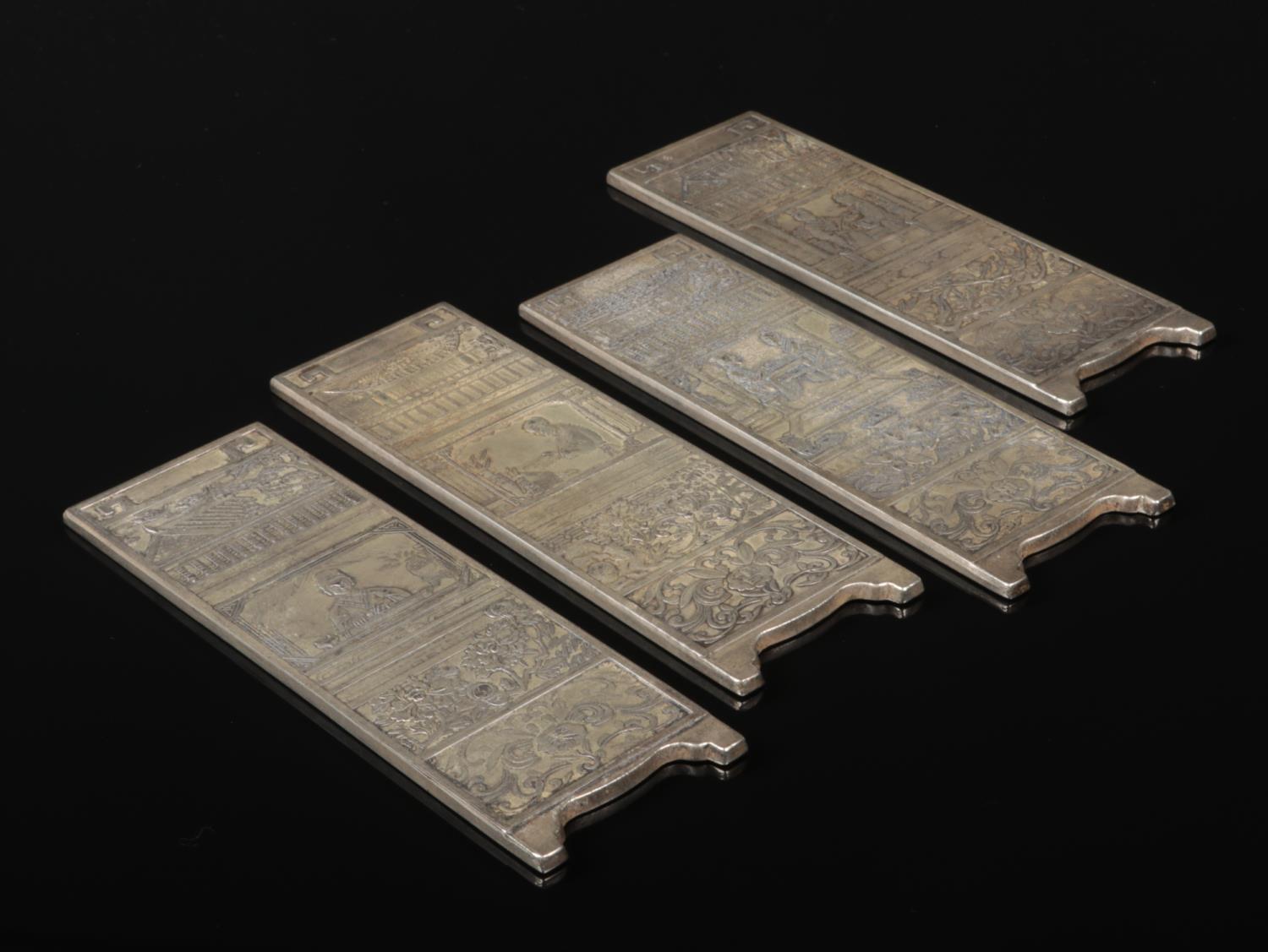 A Chinese white metal miniature four panel screen. Decorated in relief each representing a different - Image 2 of 2