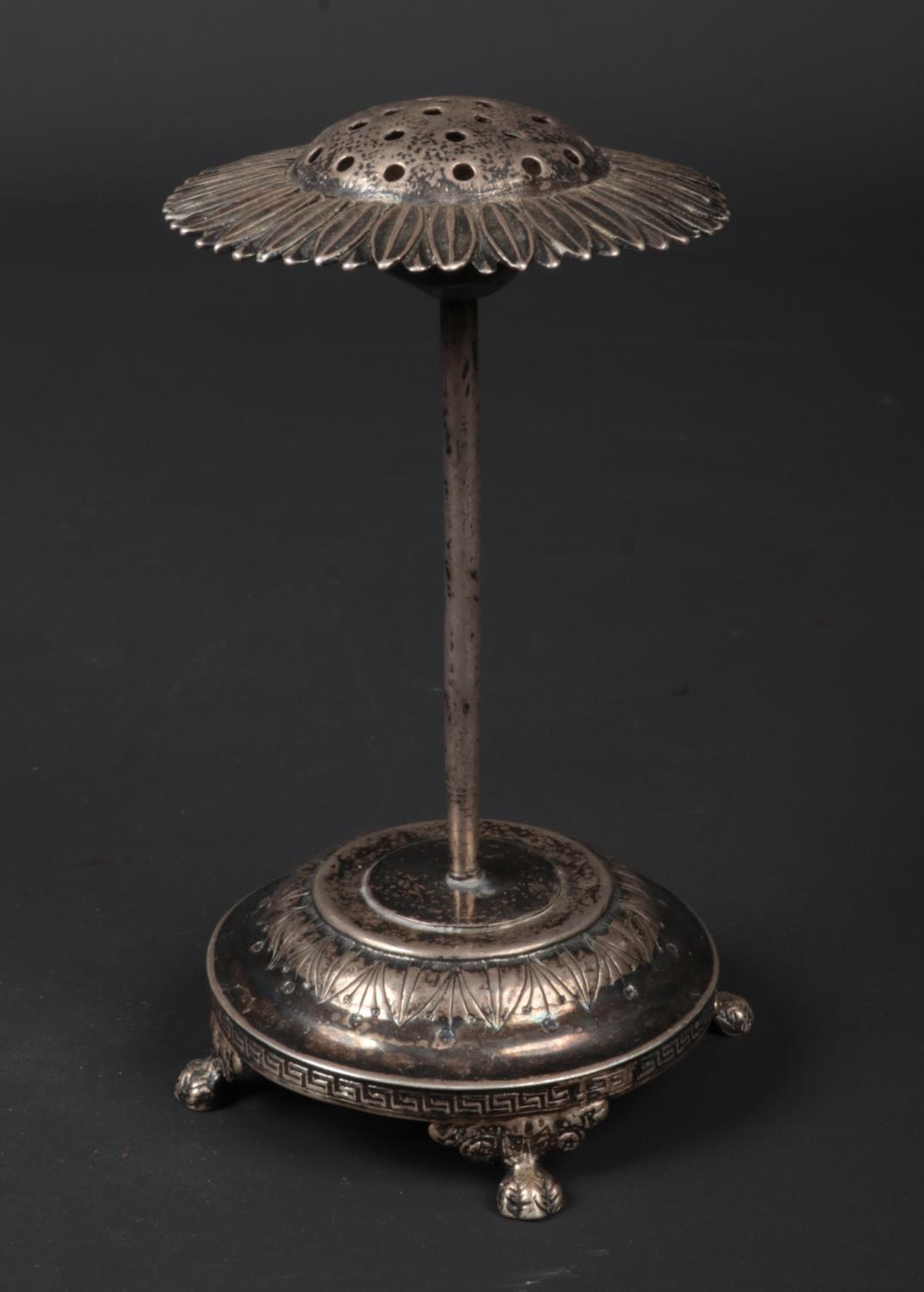 A Judaic silver stand. The top formed as a sunflower and raised on paw supports. Stamped F. Almenar,