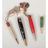 Four vintage dance pencils, two with marbleised cases.