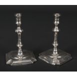 A pair of Queen Anne style silver weighted silver tapersticks by George Unite. Assayed Birmingham