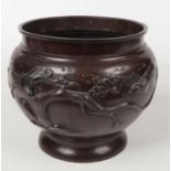 A Japanese Meiji period patinated bronze planter of plain form. Decorated in relief with birds, 25.