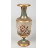 An early 20th century Vienna pedestal vase. Blue ground, with tooled gilding and decorated with a