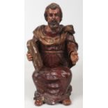 A 19th century Continental carved polychrome and gesso religious statue of Moses, seated holding a