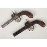 Two early 19th century box lock percussion cap pocket pistols. Each with knurled walnut stocks and
