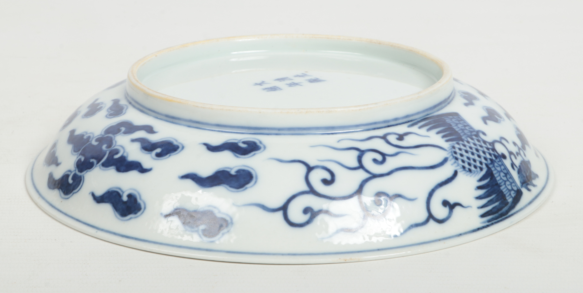 A Chinese Kangxi (1662-1722) blue and white Phoenix dish. Painted in underglaze blue with a pair - Image 6 of 9