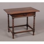 A period oak single drawer lowboy of pegged construction. With plank top, bobbin turned supports and
