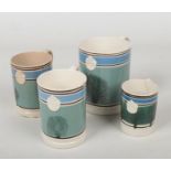 Four Llanelly mocha ware mugs. Quart, two pint and one half. Each with blue and green bands with