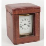 A 19th century French brass cased carriage clock in leather mounted carry case. Serpentine in