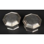 A pair of George V silver octagonal boxes and covers by Crichton Bros. With reeded borders and