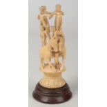 A 19th century Indian carved ivory figure group on hardwood plinth. Formed as a pair of horses and