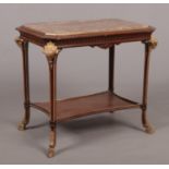 A French Empire style marble top centre table. With painted carved ram mask terminals and hoof feet.