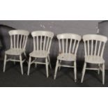 A set of four painted pine slat back kitchen chairs.