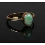 A 9ct gold and jadeite ring. Size P.