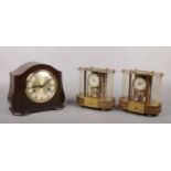A Smiths Bakelite cased 8 day mantel clock striking on three gongs. Along with two West German