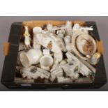 A box of crested china, to include world war one examples etc. after a cursory inspection. Canon,