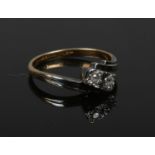 An Art Deco 18ct gold, platinum and diamond two stone ring. Size N 1/2.