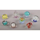 Eight glass decorative paper weights