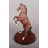 A Royal Doulton horse ' Spirit of the Wild' on wooden base (approx 34 cm height) with box