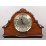 A George V walnut cased Garrard presentation 8 day Westminster chiming mantel clock. With carved