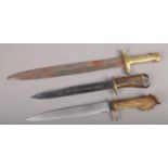 Three short swords to include brass handle gladius example etc.