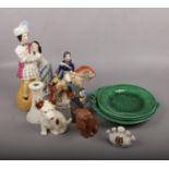 A group of ceramics, to include Staffordshire style figures, majolica plates, crested ware etc.