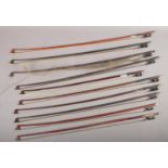 A quantity of violin bows to include one stamped Tourte example etc.