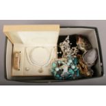 A box of costume jewellery including a cased suite of dress jewellery including a ladies bracelet