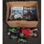 A box of Classic Bike magazines, along with four models of motorbikes.