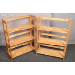 A pair of folding stackable pine shelves.
