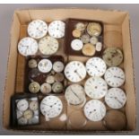 A collection of pocket and wrist watch movements and dials including 19th century examples, Waltham,