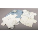 A collection of vintage baby clothing, White Lily, Cherub, examples to include a Terylene small