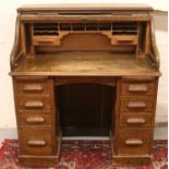 An early c20th oak roll top desk. Roll top doesn't pull down easily.