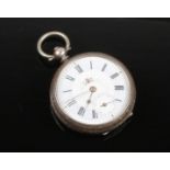 A Continental silver cased fob watch. Engraved, with enamel dial and subsidiary seconds. Stamped