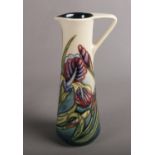 A Moorcroft contemporary jug, in Iris pattern designed by Rachael Bishop, approx 25 cm height,