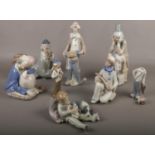 A collection of Casades porcelain figure's, to include Lladro ' Sweet dreams' Boy with puppies No.