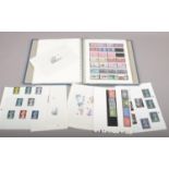 A stamp album with mint stamps, commemorative sets, and six sheets of high value stamps, to