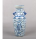 A Chinese blue and white baluster vase with twin lion dog handles. Painted in underglaze blue with