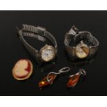 A pair of amber and silver drop earrings, two dress watches and a costume cameo brooch.