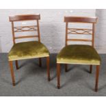 A pair of Victorian Mahogany dining chairs with spade support.