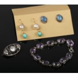 A collection of mainly silver jewellery including an amethyst bracelet, pearl brooch and three pairs