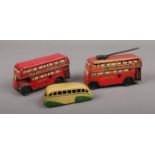 Two vintage tin plate Wells Brimtoy buses, along with a Mecanno Dinky diecast bus.