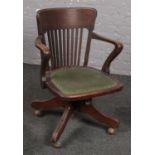 A 1940's Oak slat back office chair.