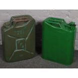 Two metal jerry cans.