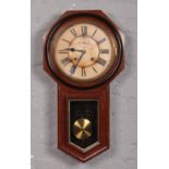 An Ansonia 8 day regulator wall clock in mahogany case with ebonised mouldings. With subsidiary