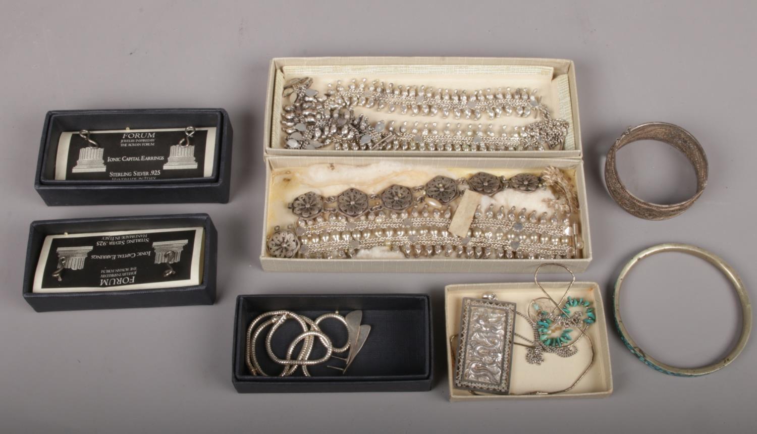 A box of silver earrings and Eastern white metal jewellery etc. Including filigree pieces and