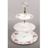 A Royal Albert three tier cake stand, 'new country roses', with box